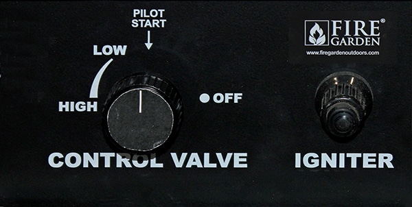 Close-up of a black grill control panel showing a large rotary valve labeled 'CONTROL VALVE' with Pilot Start, Low/High positions and an OFF indicator, plus an Igniter knob to the right.